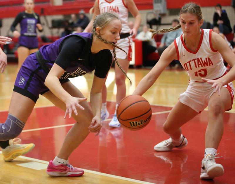 Dixon's Makenzie Toms looses control of the ball as Ottawa's Hailey Larsen defends on Wednesday, Nov. 29, 2023 at Kingman Gym.