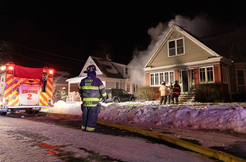 Firefighters respond to a fire Sunday, Jan. 14, 2023, at 414 Second Ave. in Ottawa.