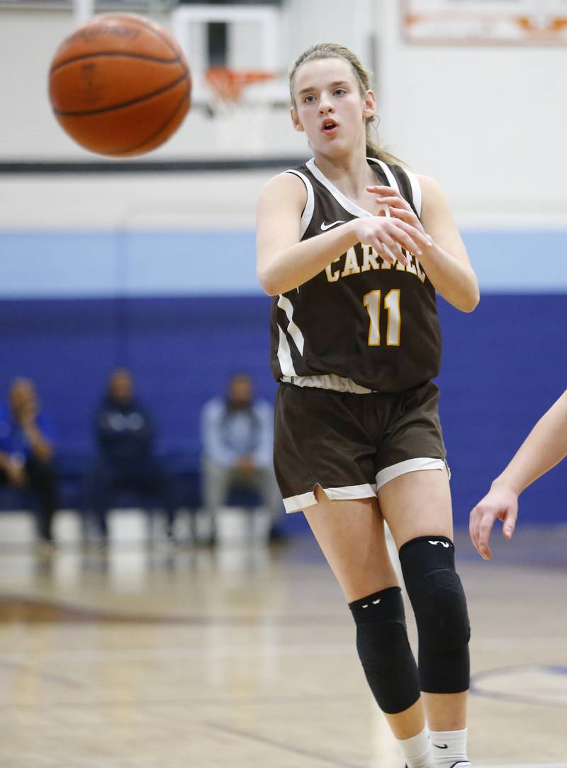 Carmel's Ashley Schlabowske (11) passes the ball during the girls varsity basketball game between Carmel High School and Nazareth Academy on Wednesday, Dec. 7, 2022 in LaGrange, IL.