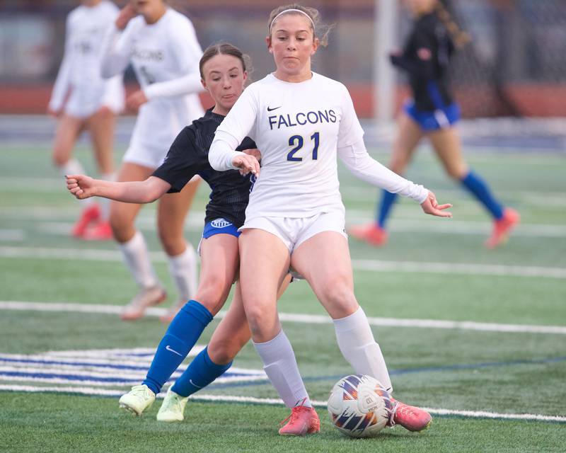 Wheaton North's Shayne Berner battles for the ball against St. Charles North on Thursday, April 10,2025 in St. Charles.