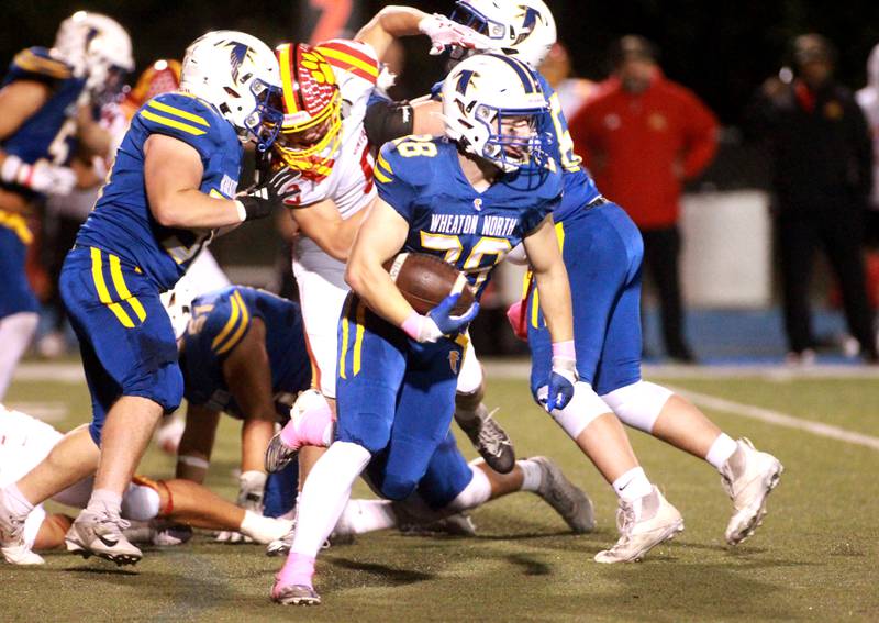 Wheaton North’s Max Serbick carries the ball during a game against Batavia on Friday, Sept. 27, 2024 at Wheaton North.