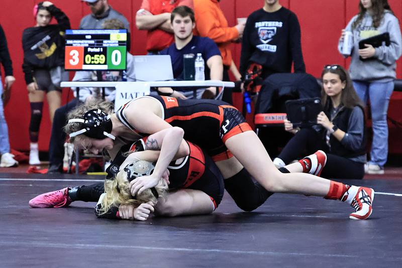 Erie-Prophetstown Panthers held their first annual Girls Wrestling Invite on Saturday, Jan. 10, 2026, at Erie High School, bringing in wrestlers from 28 schools around Illinois. Here, EP's 100 pound wrestler, Taytum Jacobs works towards her win over Heyworth's Hailey Richter. Jacobs ended her day on the podium with a 5th place medal.