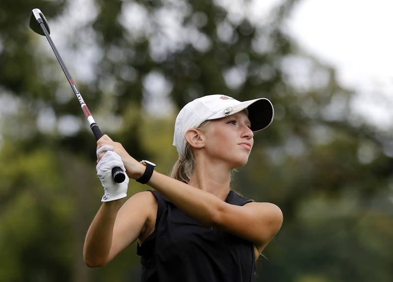 Crystal Lake Central co-op’s Rylee Rud watches her tee shot on the 13th hole during the Fox Valley Conference Girls Golf Tournament Wednesday, Sept. 24, 2025, at Crystal Woods Golf Club in Woodstock.