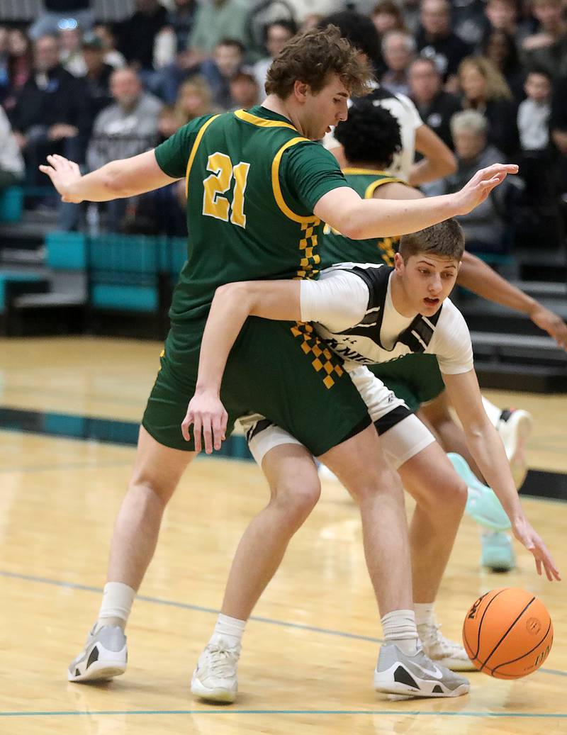 Kaneland's Connor Kimme tries to move around the defense of Crystal Lake South's Ryan Morgan during the IHSA Class 3A Woodstock North Sectional final basketball game on Friday, March 6, 2026, at Woodstock North High School.