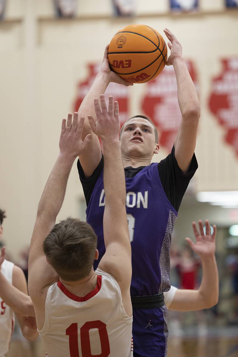 Dixon’s Cullen Shaner puts up a shot over Oregon’s Keaton Salsbury Tuesday, Feb. 4, 2025, in Oregon.