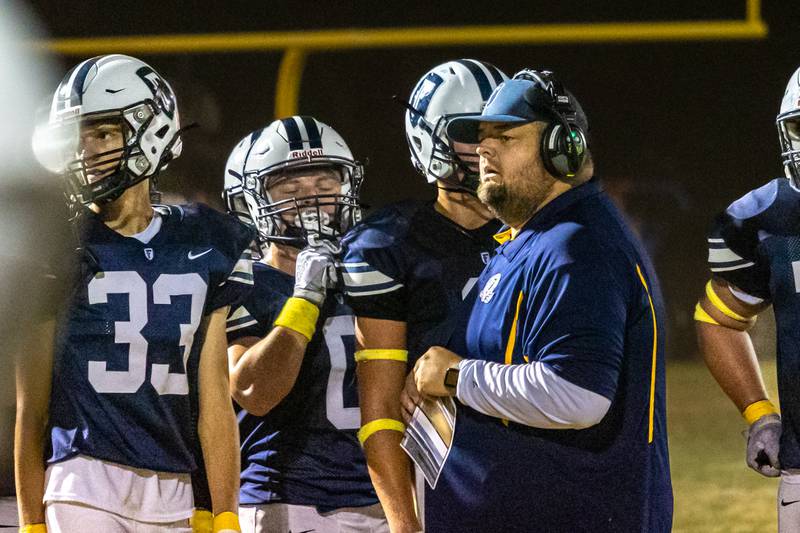 Fieldcrest coach talks to players during time out on Friday, September 20, 2024 at Fieldcrest high school in Minonk.
