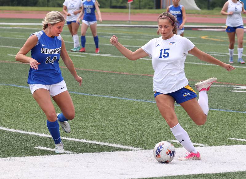 Johnsburg's Lauren McQuiston (right) kicks the ball by Columbia's Ella Fromme Saturday, June 7, 2025, during the IHSA Class 1A state championship game at North Central College in Naperville.