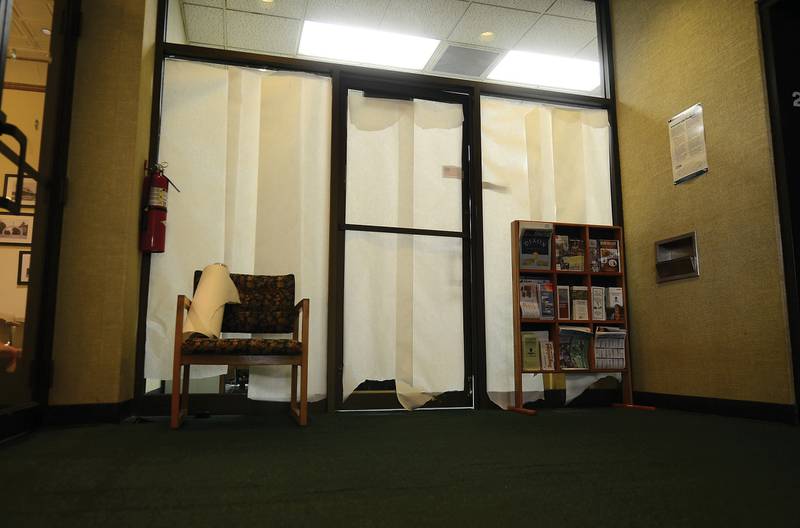 Paper covers the window April 17, 2012 leading into the financial office at Dixon city hall after federal agents arrested city comptroller Rita Crundwell on embezzlement charges.