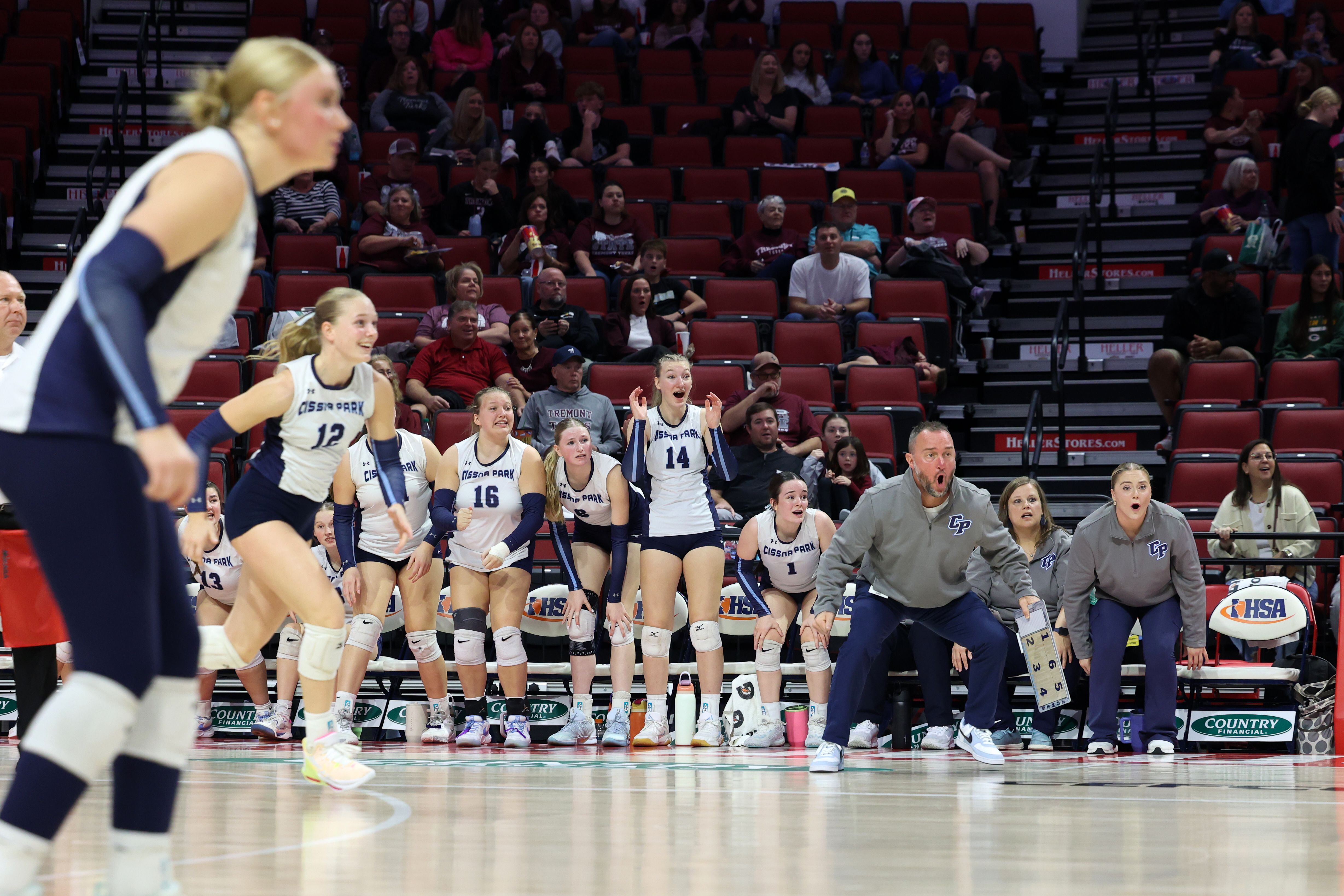 Cissna Park players and head coach Josh Landon react the team saving a wild ball during the Timberwolves' victory in two sets, 25-11, 25-14, over Stockton in the IHSA Class 1A State championship on Saturday, Nov. 15, 2025.
