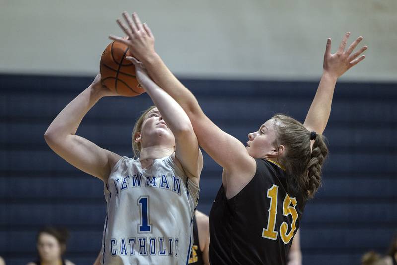 Newman’s Jessalin Johns puts up a shot while being guarded by Riverdale’s Crystal Craigmiles Thursday, Feb. 2, 2023. Thursday, Feb. 2, 2023.