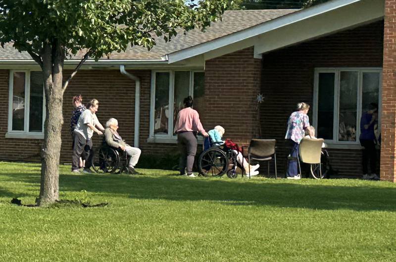 Residents of of Allure of Peru are brought back into the building after a electrical panel caught fire on Tuesday, Aug. 5, 2025 in Peru. Once on the scene, firefighters could spot smoke coming from a electrical panel in the kitchen. Several residents were evacuated. No injuries were reported. Minor damage was reported and residents were allowed to return inside.