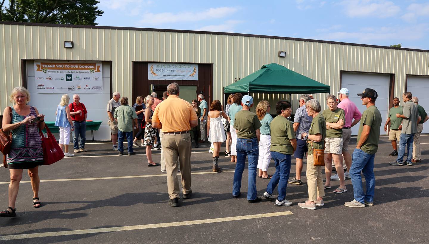A crowd gathered before the ribbon cutting at the Between Friends Food Pantry of Sugar Grove on Aug. 5, 2025.