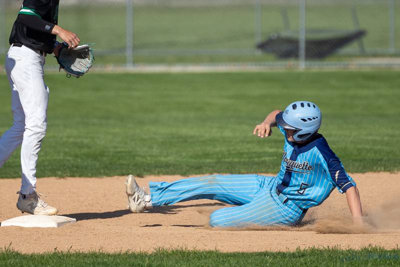 Caden Durdan (5) of Marquette slides into second base on Thursday, May 8, 2025 at Masinelli Field in Ottawa.