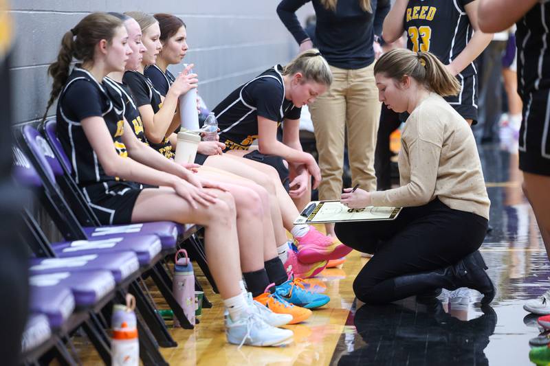 Reed-Custer head coach Shelby Zwolinski draws up a play in a timeout during Reed-Custer's 45-42 victory over Manteno on Monday, Feb. 2, 2026.