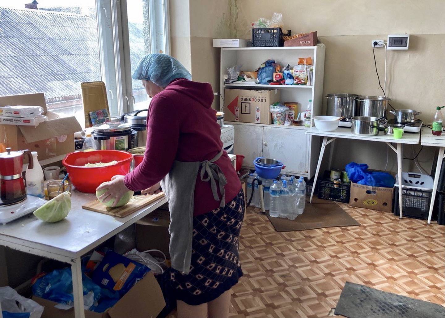Refugees cooked and cleaned in the base camp as a way to help and make money. (photo provided)