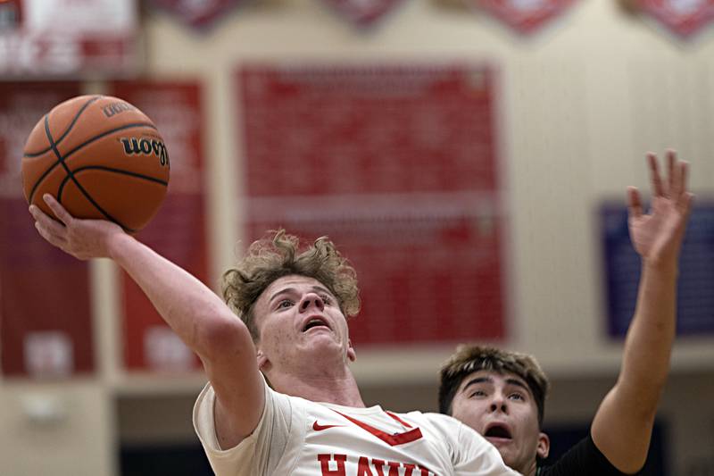 Oregon’s Noah Johnson puts up a shot after having been fouled by Rock Falls’ Austin Castaneda Tuesday, Dec. 12, 2023 in Oregon.