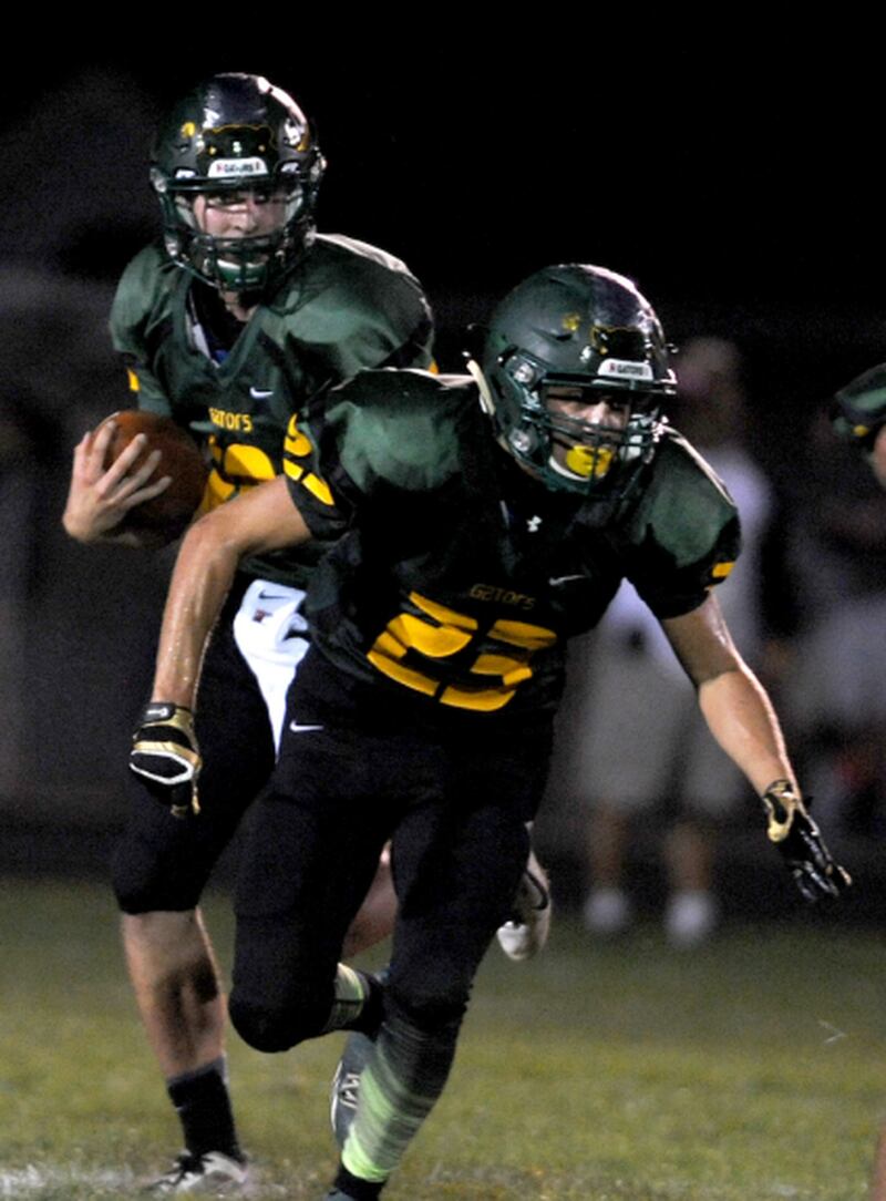 Crystal Lake South quarterback Luke Nolan (left) and running back Corey Sheehan play against Marian Central on Aug. 28.
