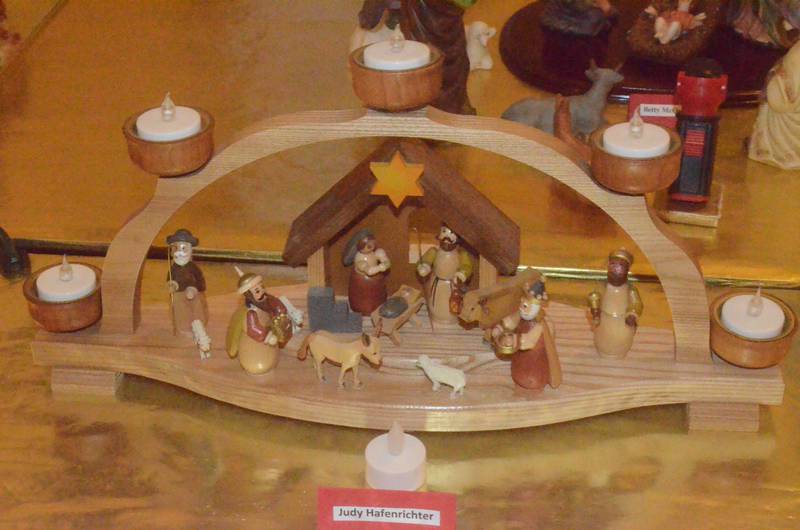 A miniature nativity set loaned by Judy Hafenrichter of Oswego is among 60 sets displayed Friday evening, Dec. 5, 2025 at Church of the Good Shepherd United Methodist of Oswego. The sets were showcased on boards across pews in the church sanctuary.