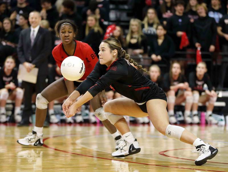 Benet's Peyton Turner (4) with a save during the IHSA Class 4A girls volleyball state title game between Benet Academy and Mother McAuley Saturday November 12, 2022 at Redbird Arena in Normal.