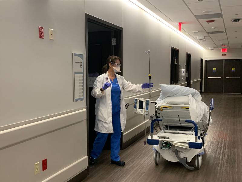 Clinical practice specialist Joan Rembacz, an advanced practice nurse at Northwestern Medicine McHenry Hospital, moves a patient into the Medical Surgical Observation Unit on Monday, Dec. 13, 2021.