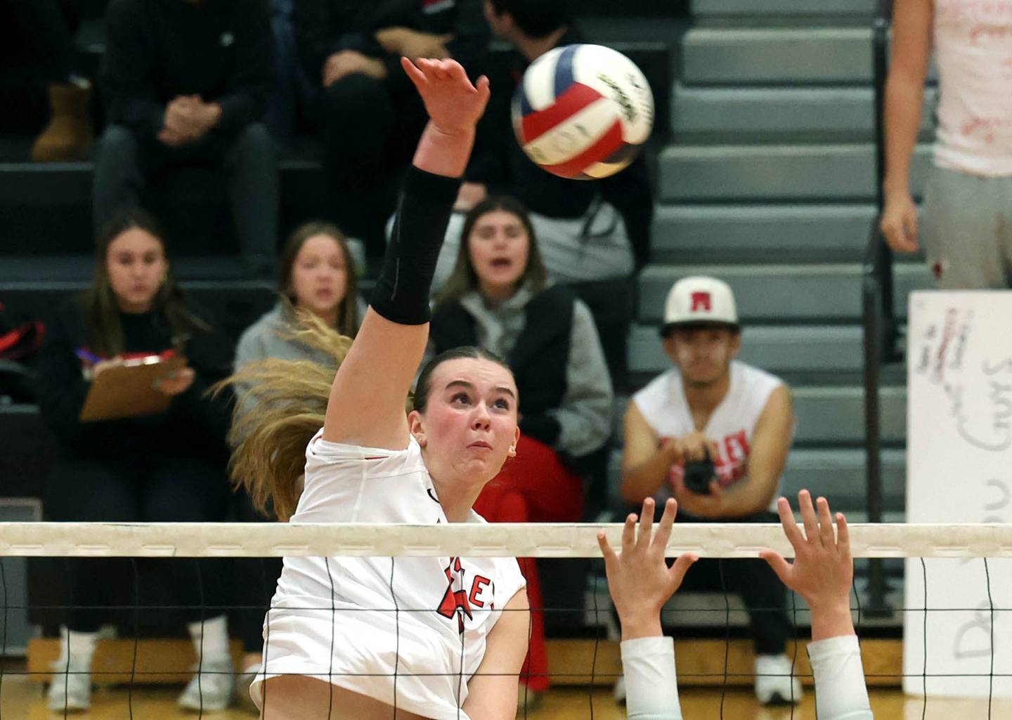 Huntley's Georgia Watson spikes the ball over Fremd’s Harper Neill Monday, Nov. 11, 2024, during their Class 4A supersectional match at DeKalb High School.