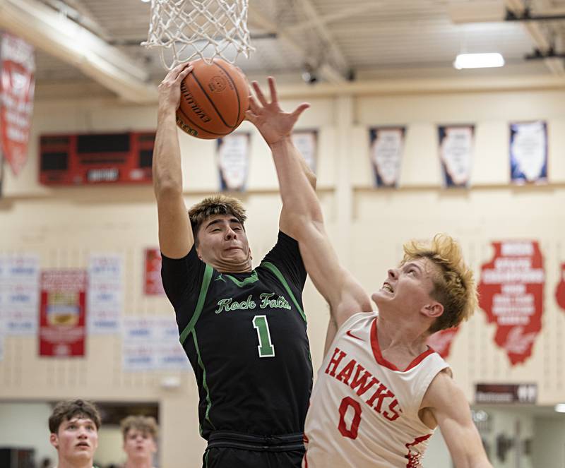 Rock Falls’ Austin Castaneda pulls in a rebound against Oregon’s Cooper Johnson Tuesday, Dec. 12, 2023 in Oregon.