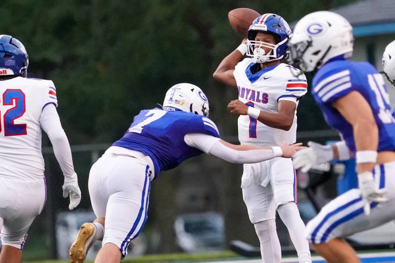 Larkin’s Julius Yandell Jr (1) is pressured by Geneva’s Sean Lane (7) during a football game at Geneva High School on Friday, Aug 30, 2024.