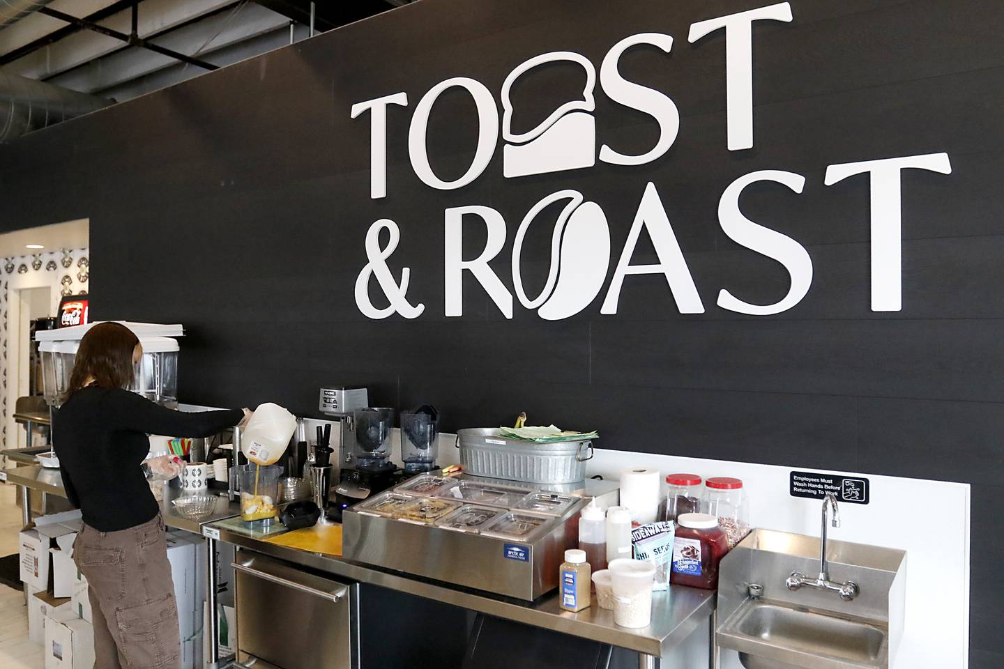 Courtney Valdes makes a smoothie for a patron on Thursday, March 28, 2024, at Toast and Roast in McHenry. The recently opened coffee shop is part of the McHenry County Coffee and Tea Trail.