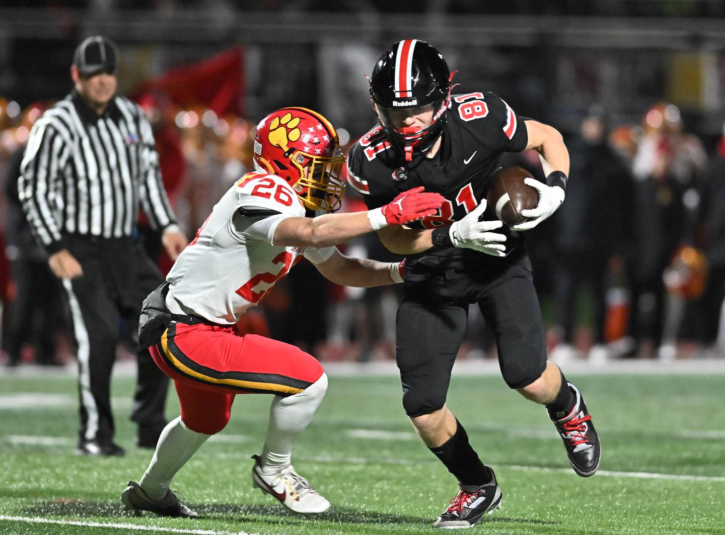 Lincoln-Way Central's Lucas Andresen (81) tries break a tackle by Batavia's Keegan Harp (26) during the Class 7A semifinal playoff game on Saturday, Nov 23, 2024 at New Lenox. (Dean Reid for Shaw Local News)