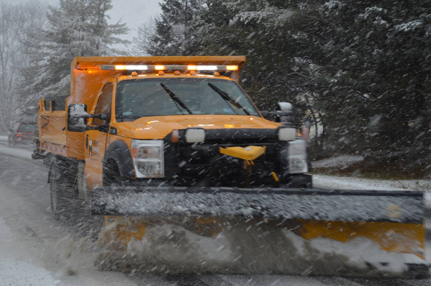A McHenry Township snowplow heads down McCullom Lake Road toward McHenry on Tuesday, Dec. 28, 2021, the new National Weather Service record for the latest measurable snowfall in Northern Illinois.