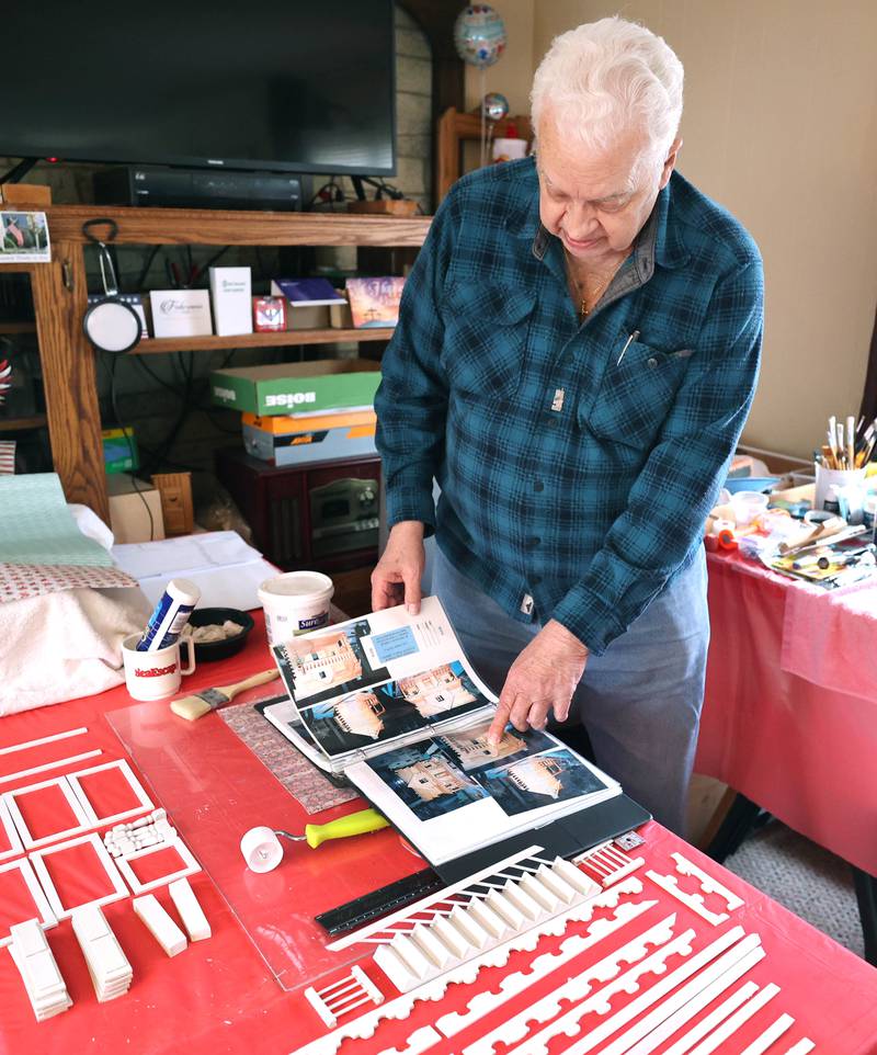 Sycamore resident Lee Newtson talks Thursday, March 24, 2022, about some of the dollhouses he has built over the years for various charitable organizations. Newton is currently finishing up a house that will be raffled off as a fundraiser to benefit Ukraine.
