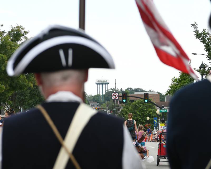Sons of the American Revolution Fox Valley Chapter march during the Independence Day parade on Friday July 4, 2025, held in downtown Downers Grove.