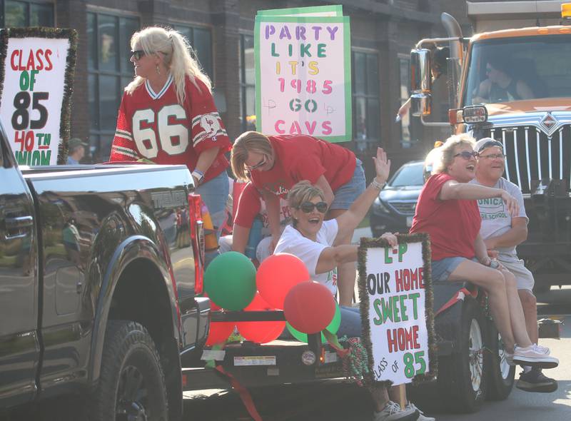 The L-P Class of 1985 ride a float during the L-P homecoming parade on Thuesday, Oct. 2, 2025 downtown Peru.