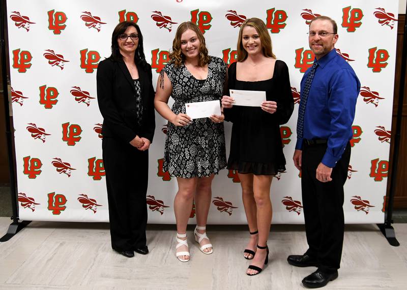 Hope Eldridge and Carlie Miller received the Dale Family Scholarship. This $500 scholarship is awarded to La Salle-Peru High School seniors who demonstrate a desire to make a difference in the world. The scholarship was presented by Rodney and Rici Dale.