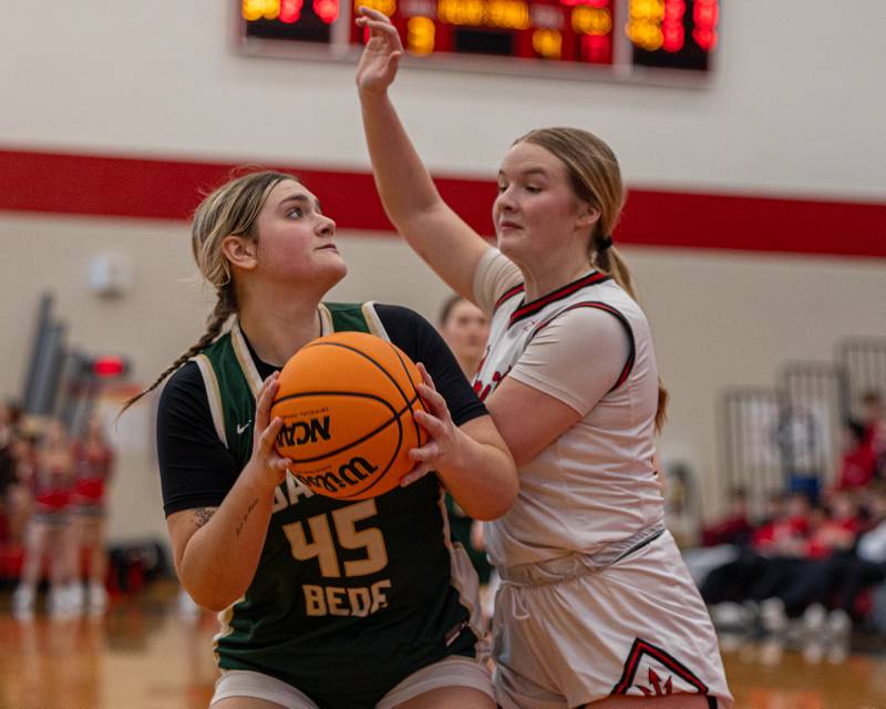 Savannah Bray (45) of St. Bede looks up to rim before shooting ball whilst being defended by Caroline Morris (13) of Hall on Saturday, January 31, 2026 at Hall High School in Spring Valley.