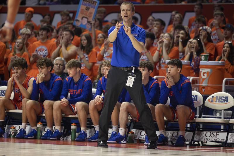 Eastland coach Tyler Zumdahl leads his team against Peoria Christian Thursday, March 13, 2025, during the Class 1A boys basketball state semifinal.