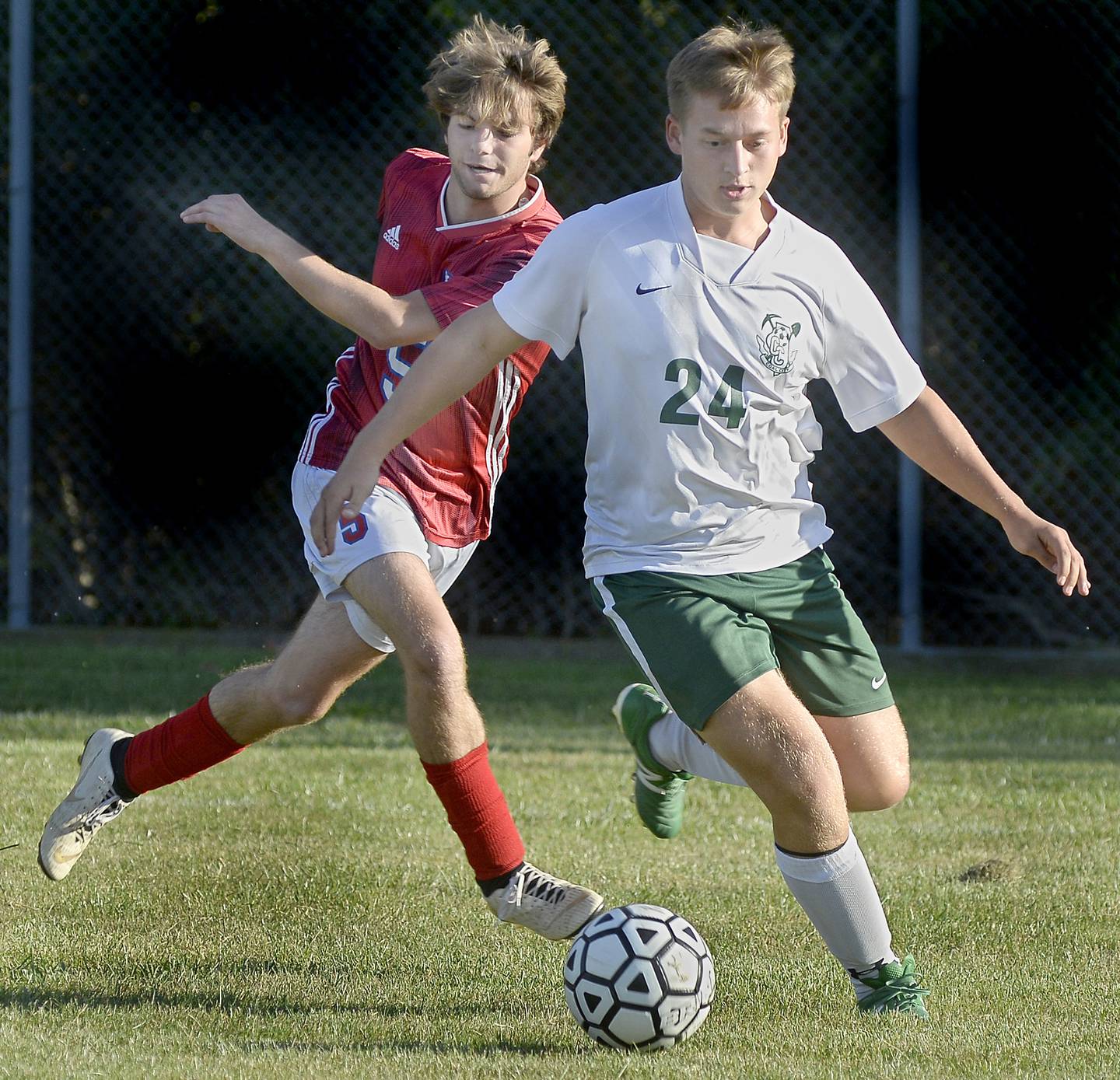 Streator's Kannin Angelico (5) gives chase to the ball with Coal City’s Jackson Wilcock during first half of a match Tuesday Oct. 4, 2022 at Streator.