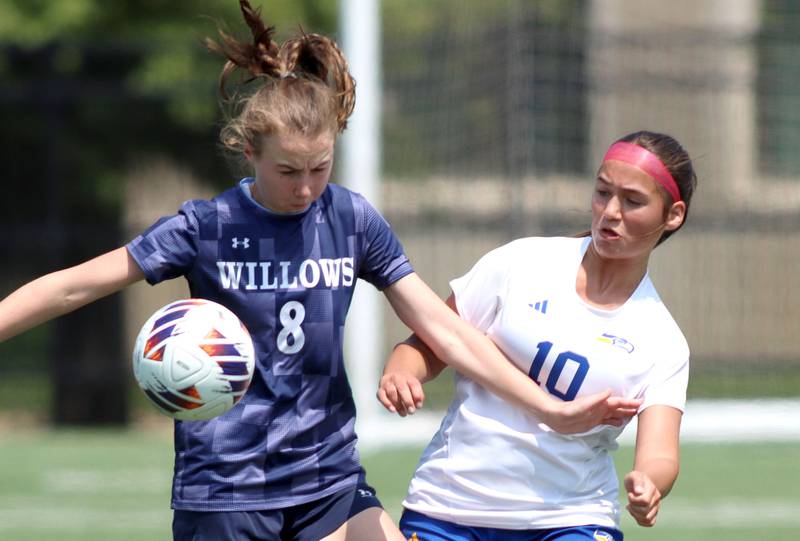 Johnsburg’s London Baidinger, right, battles Willows Academy’s Elizabeth Spencer in IHSA Class 1A Supersectional soccer action at Dominican University in River Forest on Saturday, May 31, 2025.