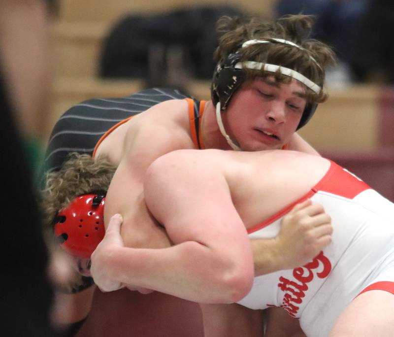 Huntley’s Dylan Cerny, bottom, battles Crystal Lake Central’s Cayden Parks at 190 pounds in varsity wrestling on Friday, Dec. 13, 2024 at Huntley High School in Huntley.