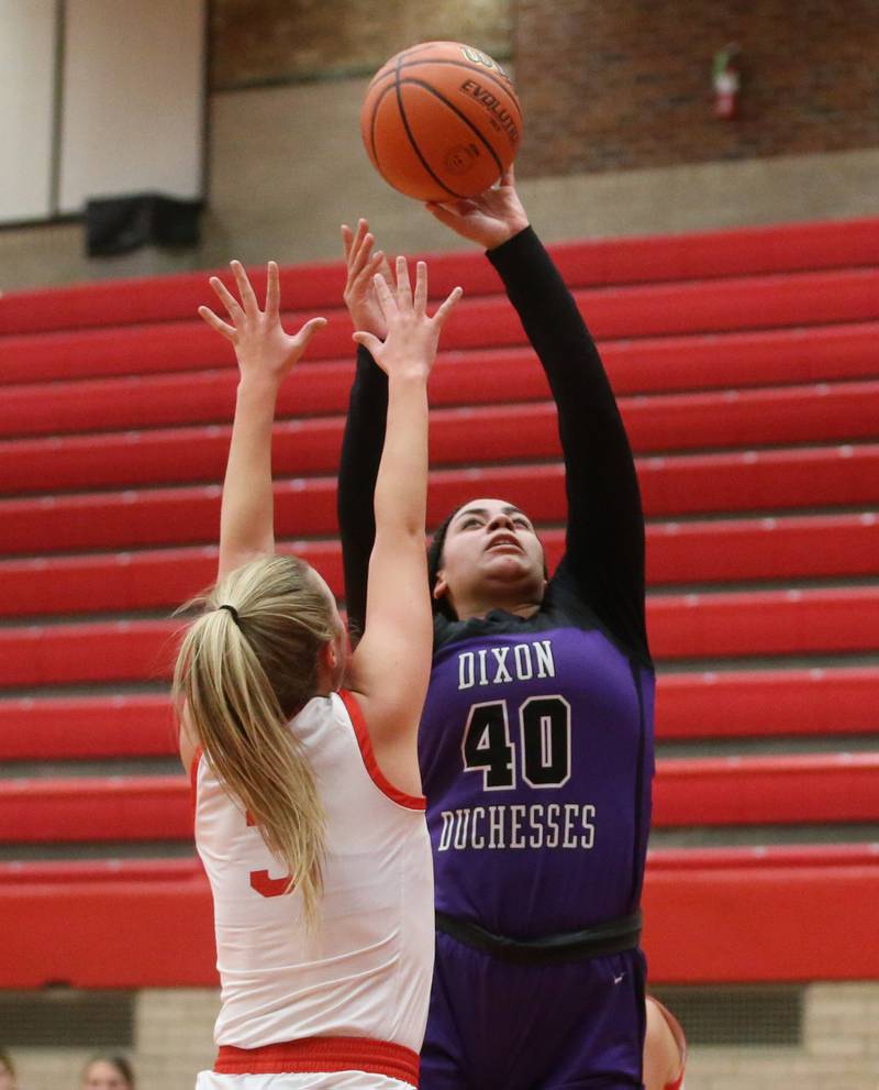 Dixon's Hallie Williamson pulls up in the lane to shoot a jump shot over Ottawa's Skyler Dorsey on Wednesday, Nov. 29, 2023 at Kingman Gym.
