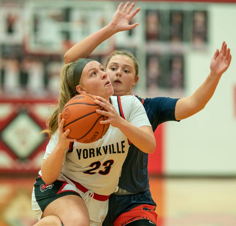 Yorkville's Courtney Morse (23) drives to the basket against Oswego during the 13th annual Hoops 4 Hope Communities vs. Cancer basketball event at Yorkville High School on Saturday, Jan 28, 2023.