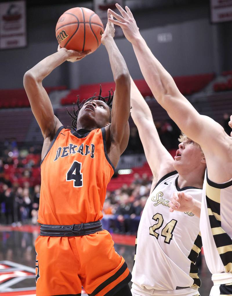 DeKalb's Johnny Henderson shoots in front of Sycamore's Lucas Winburn during the First National Challenge Friday, Jan. 27, 2023, at The Convocation Center on the campus of Northern Illinois University in DeKalb.