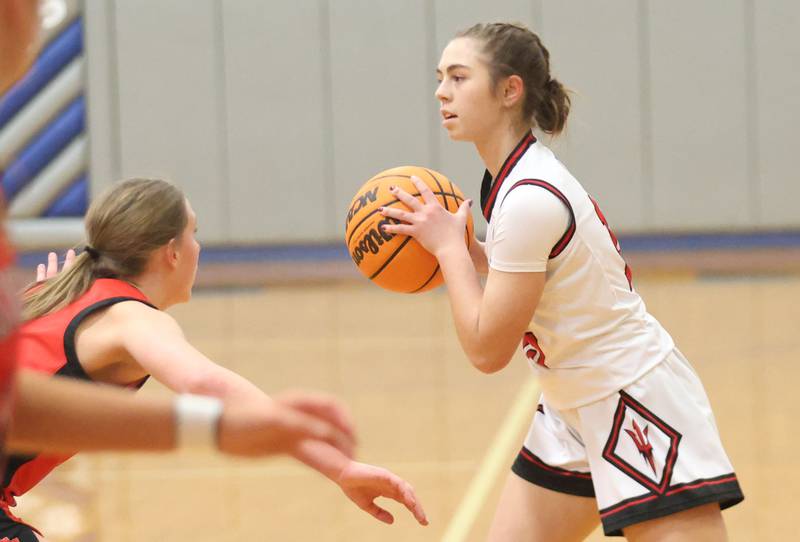 Hall's Bernadette Larsen looks to pass the ball around Stark County defenders during the Tiger Girls Basketball Holiday Tournament on Tuesday, Nov. 18, 2025 at Princeton High School.