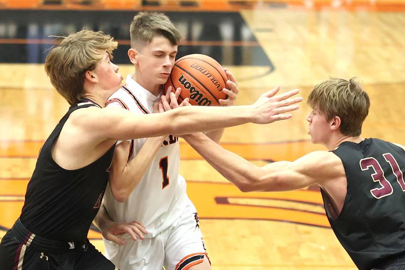 DeKalb's Jackson Kees drives between two Dunlap players during their game Monday, Nov. 21, 2022, at DeKalb High School.