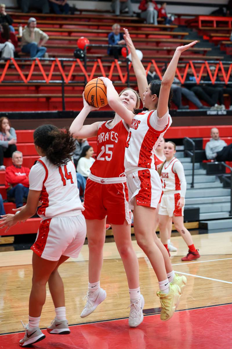 Ottawa's Libby Muffler shoots under pressure from Bradley-Bourbonnais' Abby Bonilla during Ottawa's 55-44 victory on Monday, Feb. 9, 2026.