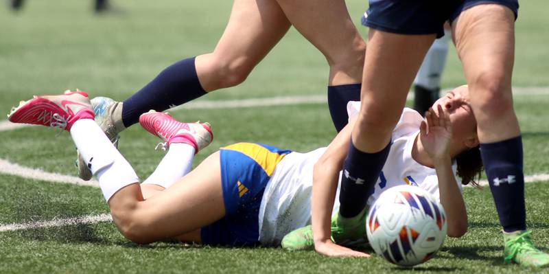 Johnsburg’s Liz Smith gets tripped up against Willows Academy in IHSA Class 1A Supersectional soccer action at Dominican University in River Forest on Saturday, May 31, 2025.