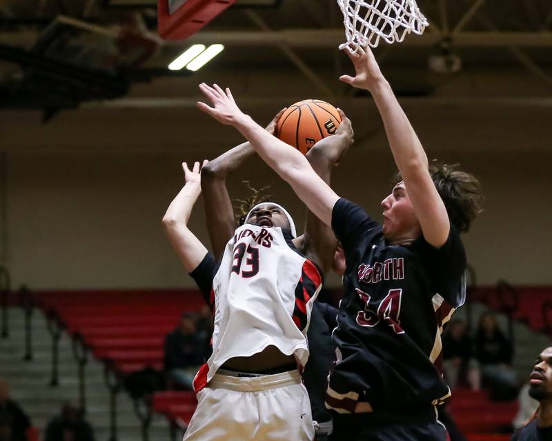 Bolingbrook's Jeremy Mccullum (33) is fouled on a drive to the basket during their basketball game between Plainfield North at Bolingbrook, Friday Dec 13, 2024 in Bolingbrook.