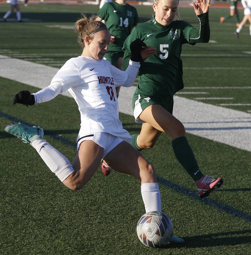 Huntley's Maddie Cummings takes to take a shot on goal as she is defended by Boylan Catholic's Gracie Rose during a nonconference soccer game on Wednesday, March 27, 2024, at Huntley High School.