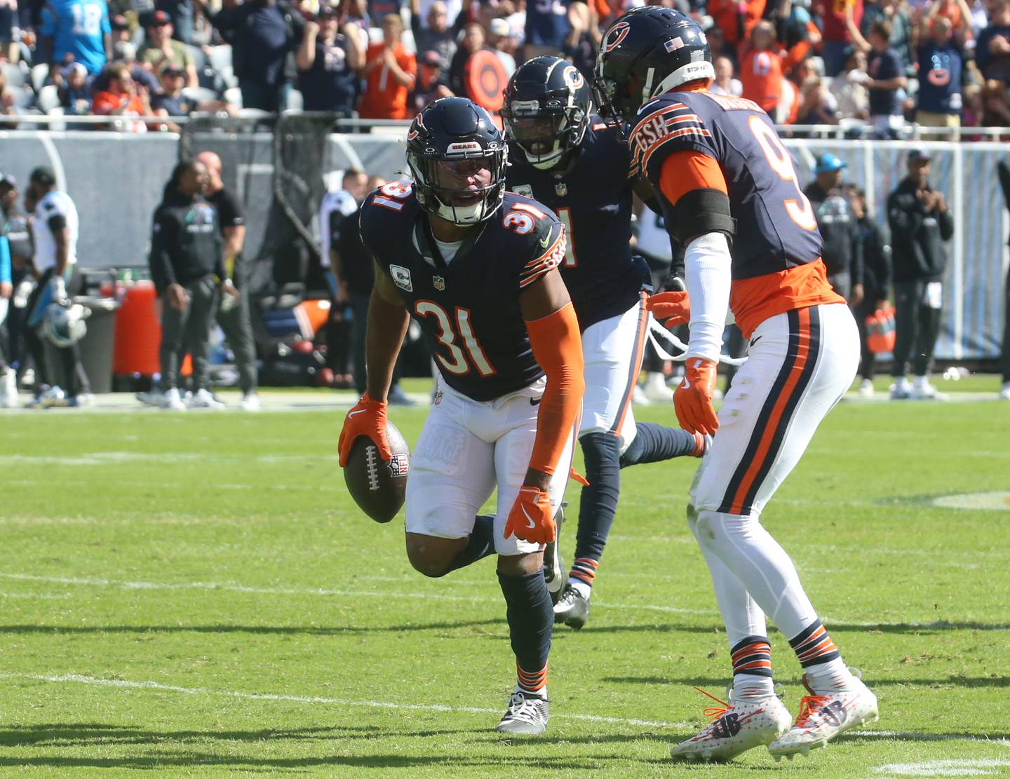 Chicago Bears defensive back Kevin Byard III reacts with teammate Jaquan Brisker after making an interception against the Carolina Panthers on Sunday, Oct. 6, 2024 at Soldier Field in Chicago.