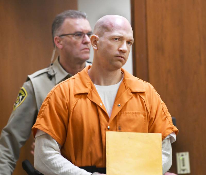 Matthew Plote is escorted into an Ogle County courtroom by court officials on Thursday, Jan. 19.